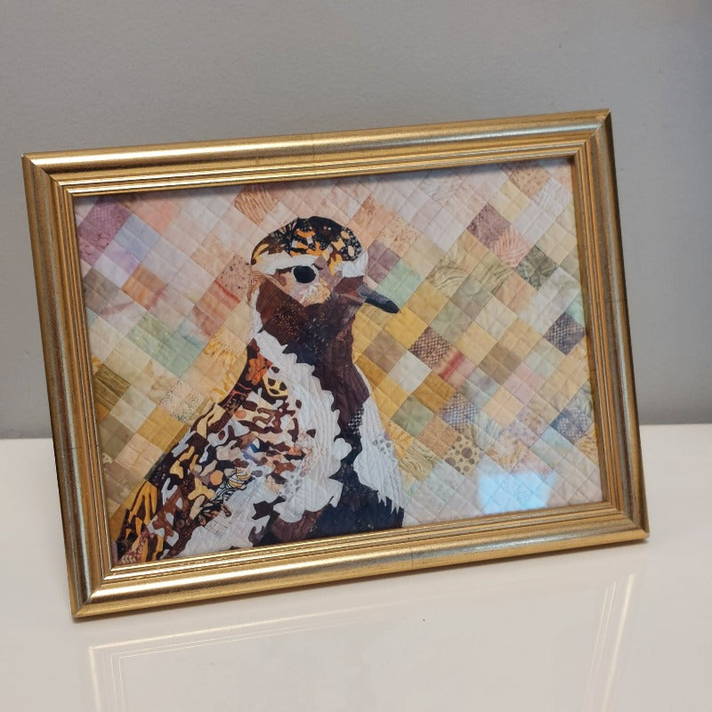 The_Golden_Plover_has_arrived_poster_quilt_in_a_frame